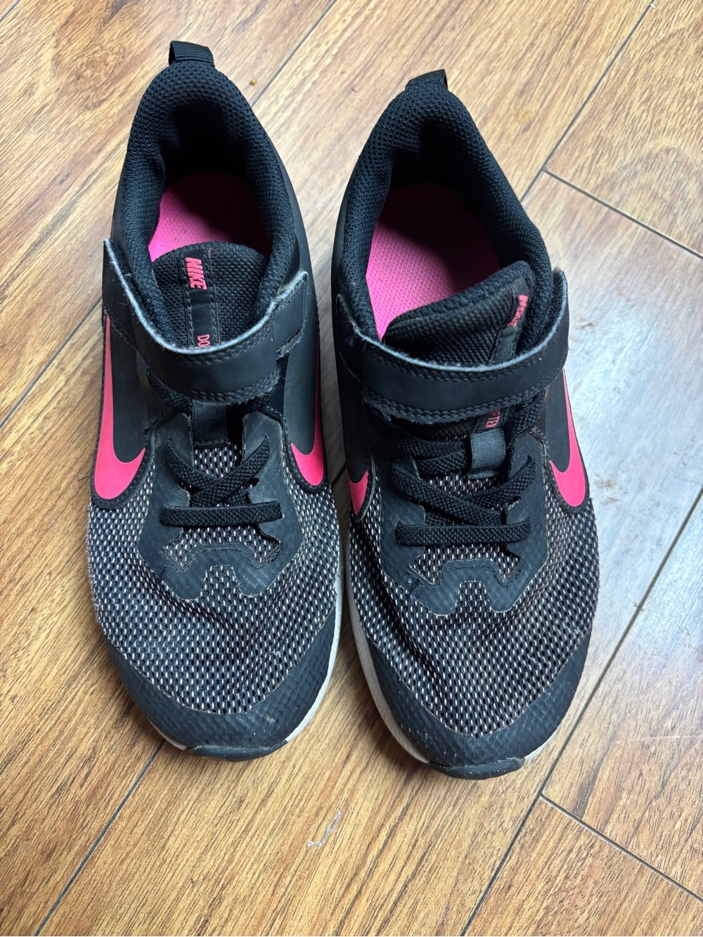 Nike Kids Black Sneakers with Pink Swoosh